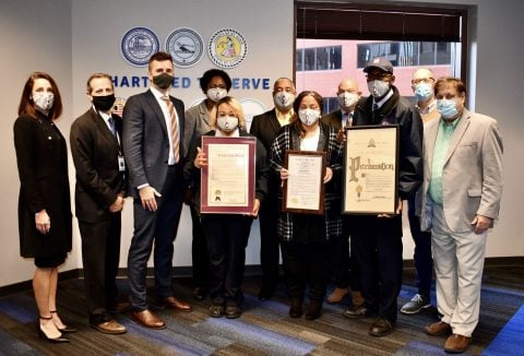 Group photo of BSD Commissioners and executives, local officials, and Metro Transit operators being presented with a proclamation for Transit Driver Day
