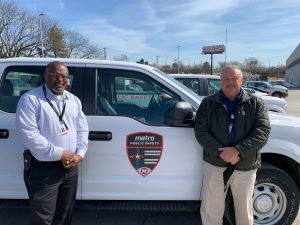 Vern Summers and Tony Smoote standing in front of a Metro Public Safety truck.