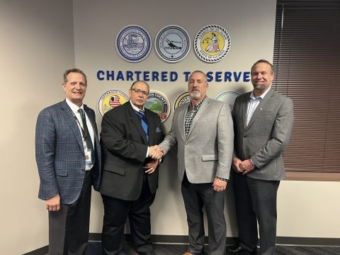 Photo of Bi-State Development President & CEO Taulby Roach, Bi-State Development Board Chairman Herbert Simmons, IBEW Local 2 Business Manager Ken Pebbles, and IBEW Local 309 Asst. Business Manager Mark Link