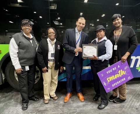 Metro Transit staff presenting a certificate