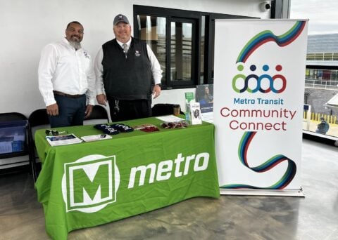 BSD team members at a Metro table ready to assist customers at Community Connect